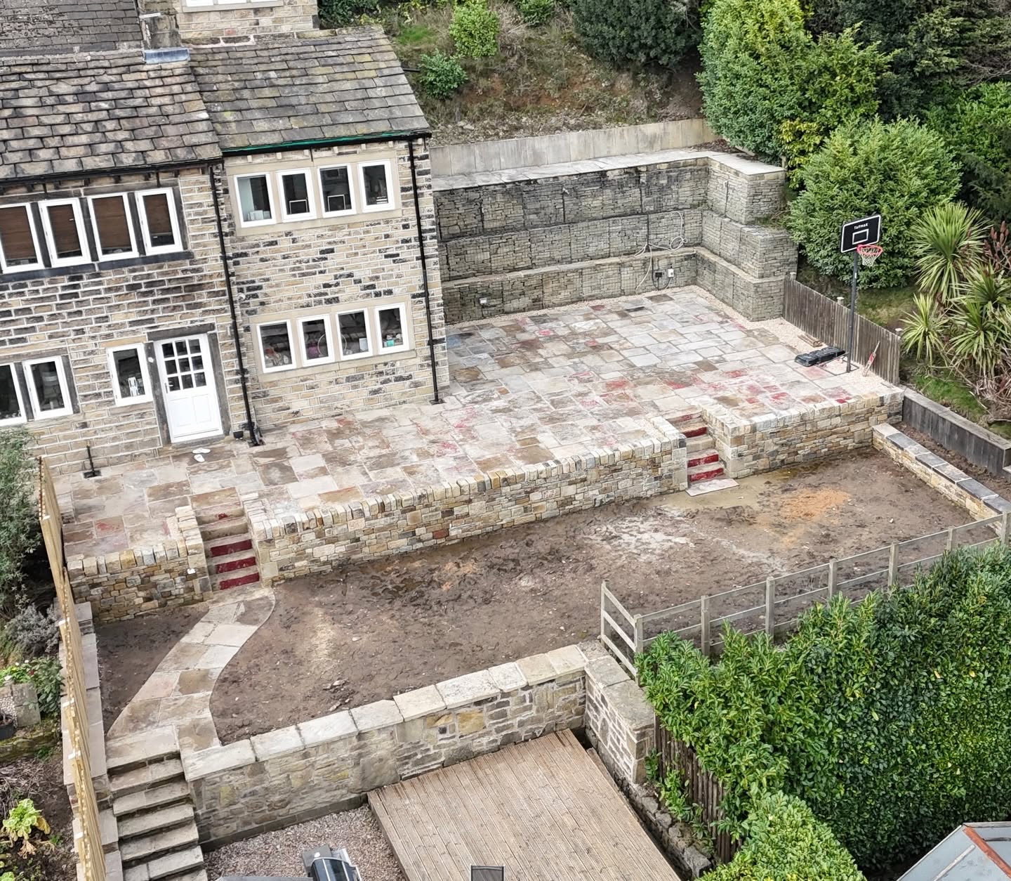 Stone landscaping and retaining walls at a Colne Valley garden project
